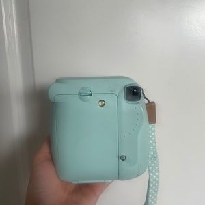 Lightly used Mint blue fujifilm instax Polaroid camera